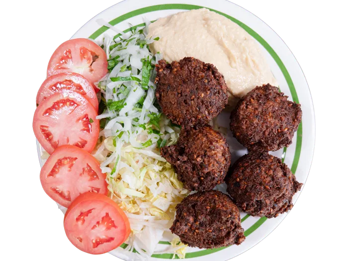 Golden falafel plate with tahini, salad and pita