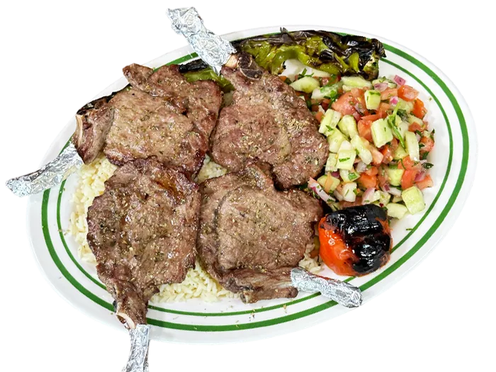 Four char-grilled lamb chops with mint and lemon