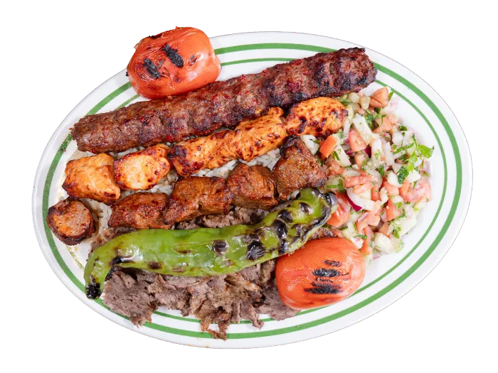 Mix grill platter with lamb shish, Adana, chicken kebab and lamb chop over rice